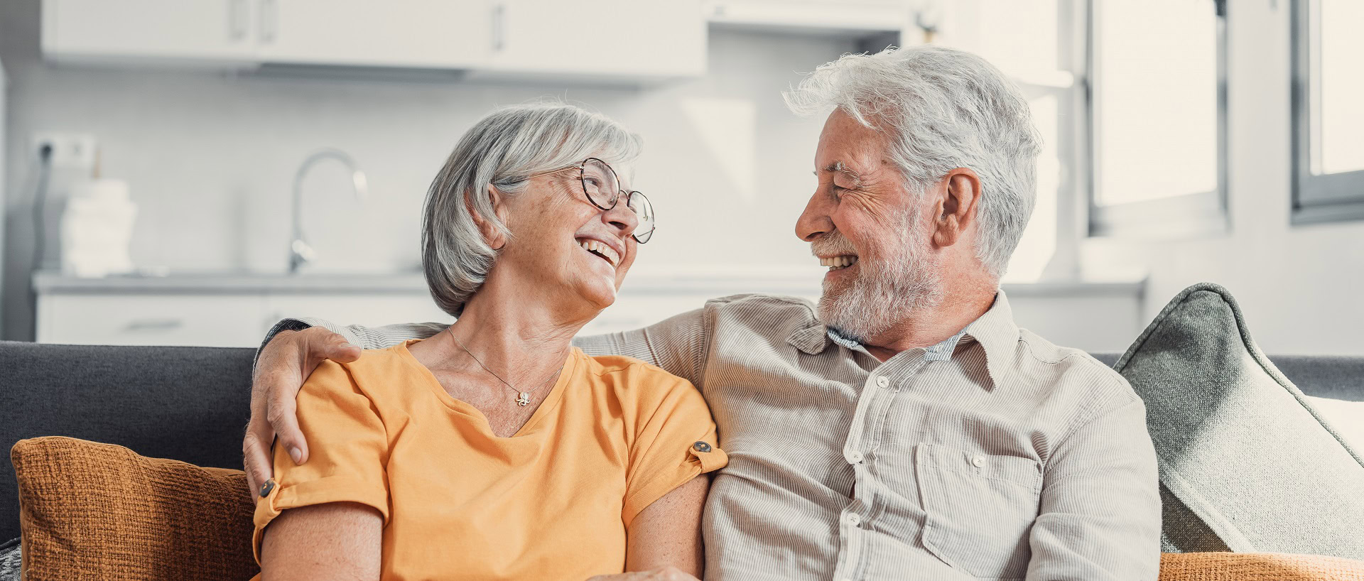 happy-laughing-older-married-couple-talking-laughing-standing-home-interior-together-hugging-with-love-enjoying-close-relationships-trust-support-care-feeling-joy-tenderness