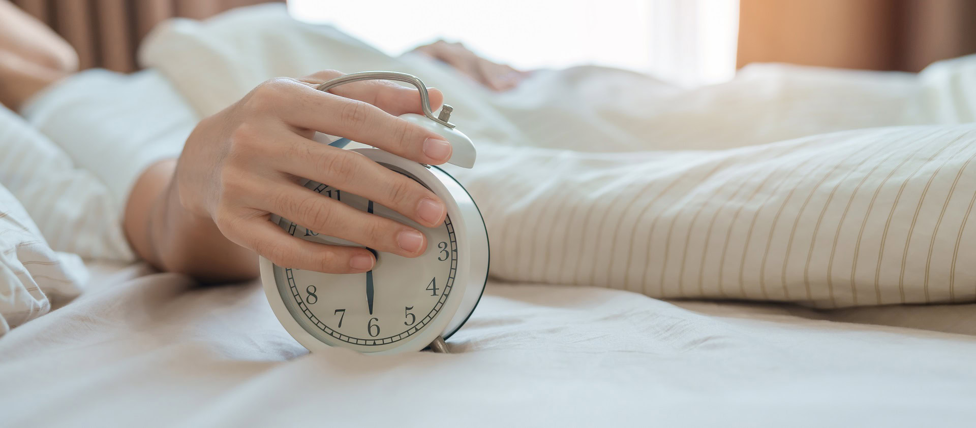 alarm-clock-asian-woman-hand-stop-time-bed-while-sleeping-young-adult-female-wake-up