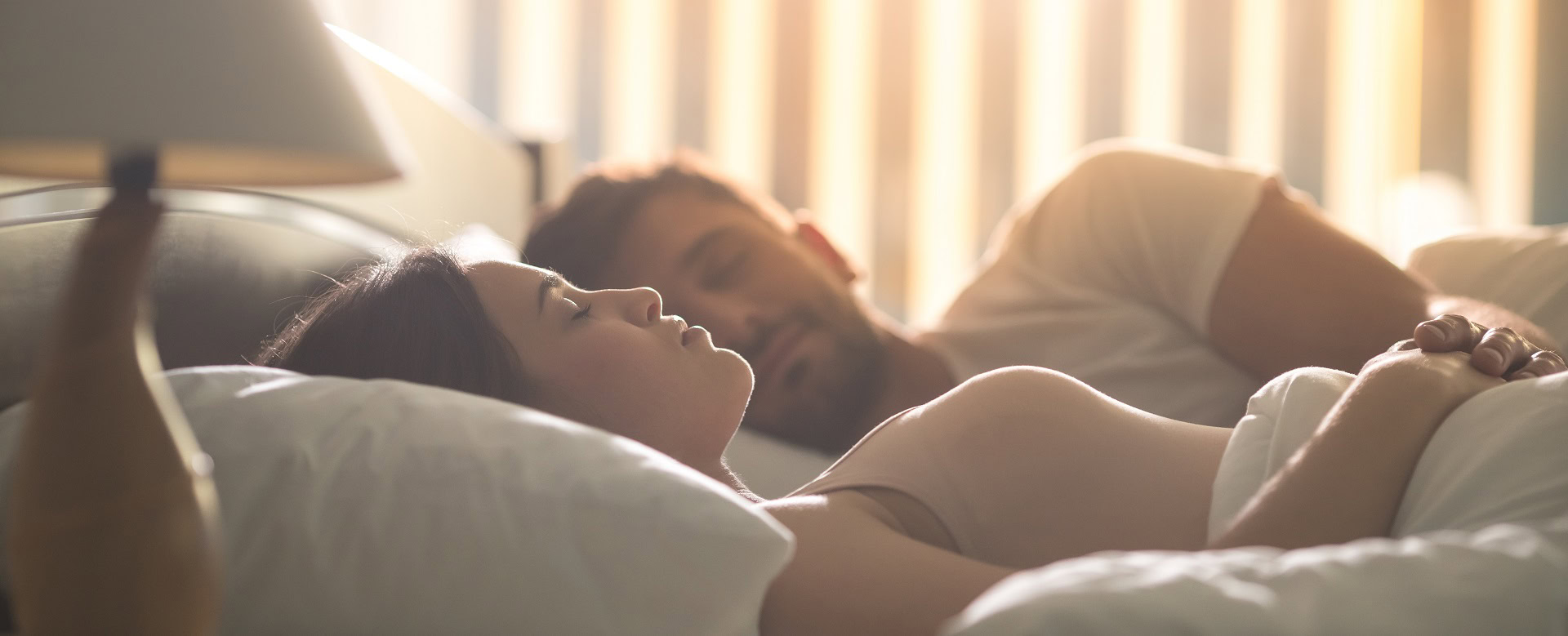 attractive-woman-sleeping-near-man-comfortable-bed-night-time